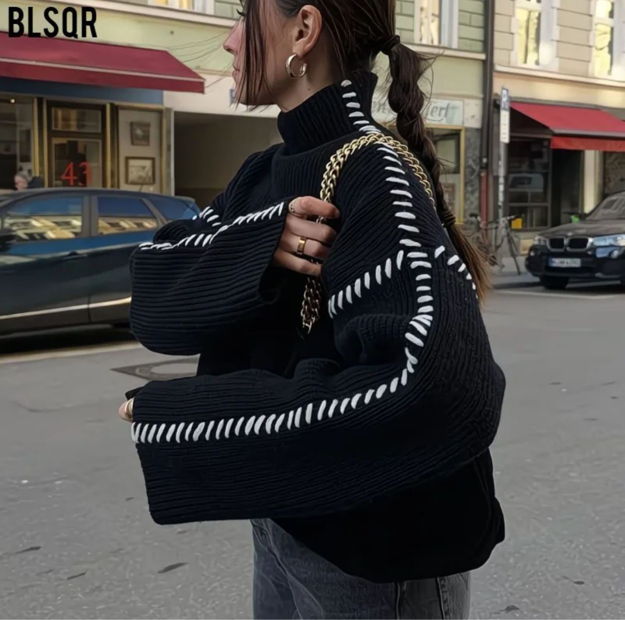 Pull Noir à Surpiqûres Blanches – Style Chic & Urbain