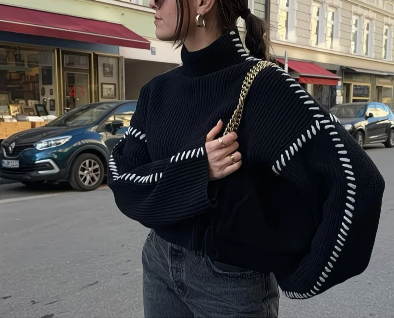 Pull Noir à Surpiqûres Blanches – Style Chic & Urbain